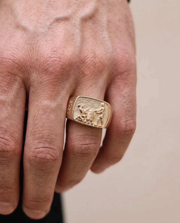 Lucasfilm 14kt gold signet ring with an embossed relief of Pharaoh, R2D2 and C-3PO and the year '2026' on the band, 